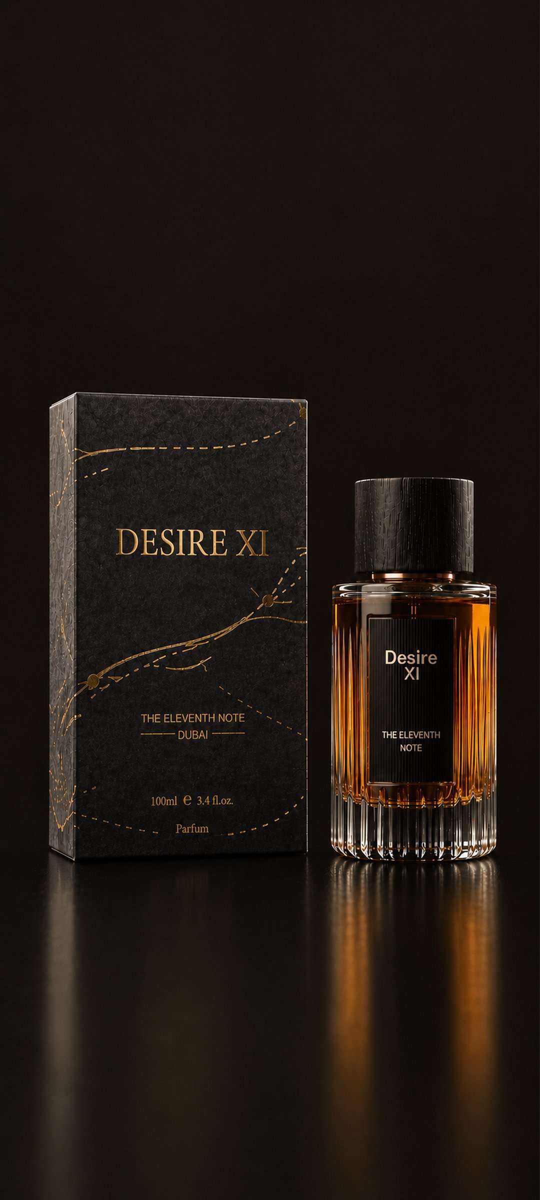 Desire XI parfum in fluted crystal with a blackwood cap, beside its gold-foiled box, lit against black.